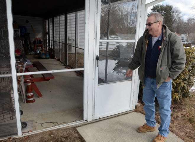 Killingly Housing Authority Maintenance Supervisor Don Chatelle shows where the town is going to replace the screens on the porches with plastic at Birchwood Terrace in Killingly. [Aaron Flaum/NorwichBulletin.com]
