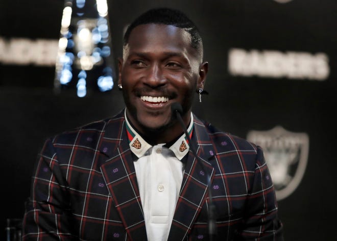Oakland Raiders wide receiver Antonio Brown smiles during the NFL football team's news conference Wednesday, March 13, 2019, in Alameda, Calif. (AP Photo/Ben Margot)