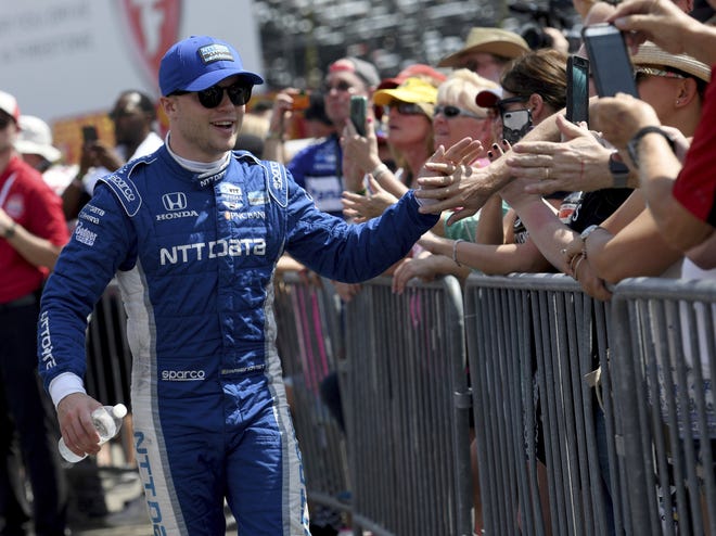 Felix Rosenqvist greets fans before the IndyCar Firestone Grand Prix of St. Petersburg. With a strong IndyCar debut on Sunday, the Swede validated the buzz around Chip Ganassi Racing's newest hire. [The Associated Press / Jason Behnken]