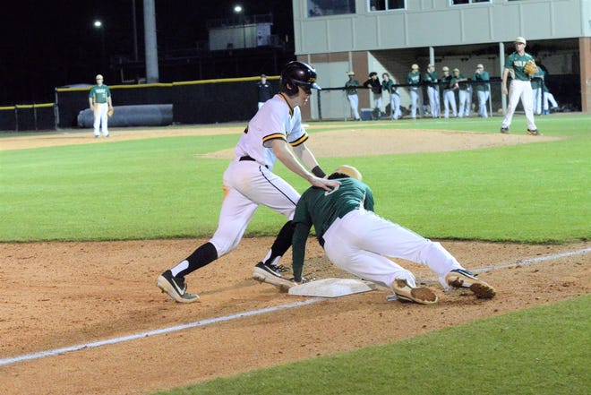 Chase Brown steals third base as the ball gets away from the Blake Brantley. Brown scored in the bottom of the third inning. [Photo by Gilbert Miller] 030819