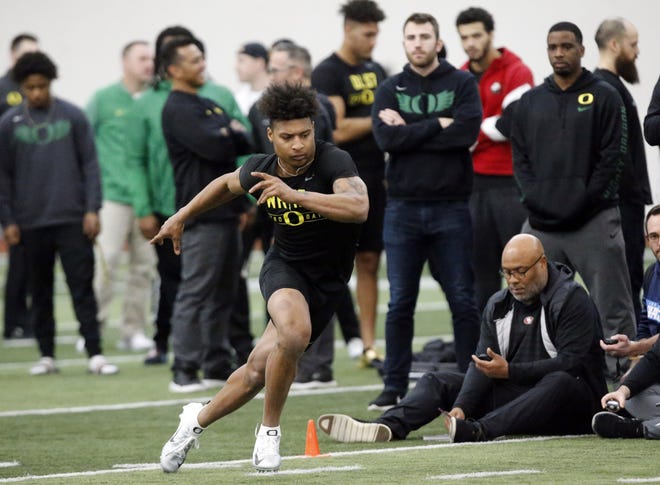 Former Oregon wide receiver Dillon Mitchell participates in a drill during the Oregon pro day at the Moshofsky Center. [Andy Nelson/The Register-Guard] - registerguard.com