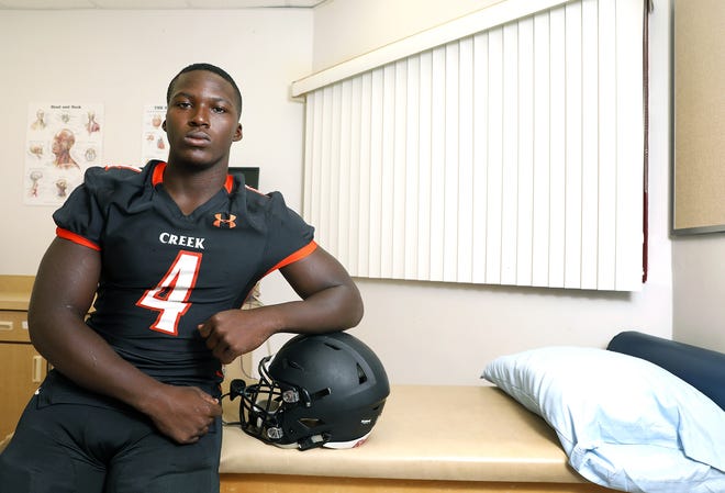 Spruce Creek's Marvin Scott, a coveted running back recruit, completed a 395-pound bench press. [News-Journal/Nigel Cook]