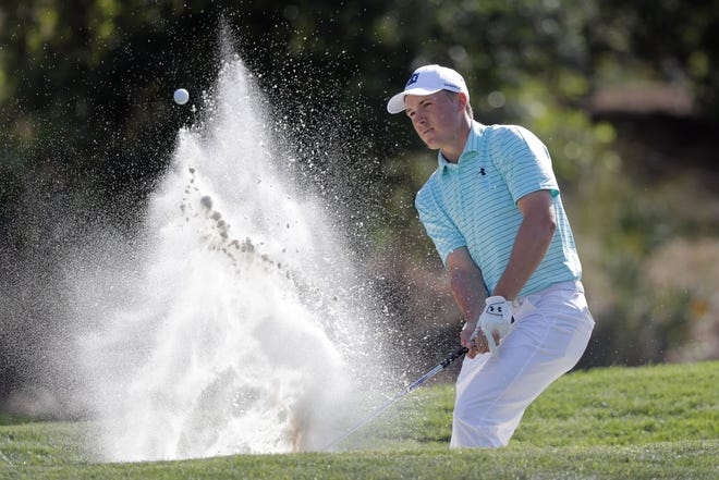 Jordan Spieth blasts from the trap on the eighth hole during the first round of The Players Championship golf tournament Thursday, March 14, 2019, in Ponte Vedra Beach, Fla. (AP Photo/Gerald Herbert)