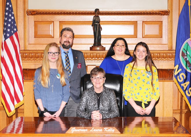 Two HMS-7 Students traveled to Topeka on March 12 to serve as pages for State Rep. Jason Probst. They spent the day learning about state government, working on the House floor, and exploring the state capitol. Pictured from left to right are Hayley Waymire, Rep. Jason Probst, Gov. Laura Kelly, Tori Graf, and Emma Graf. [Courtesy]