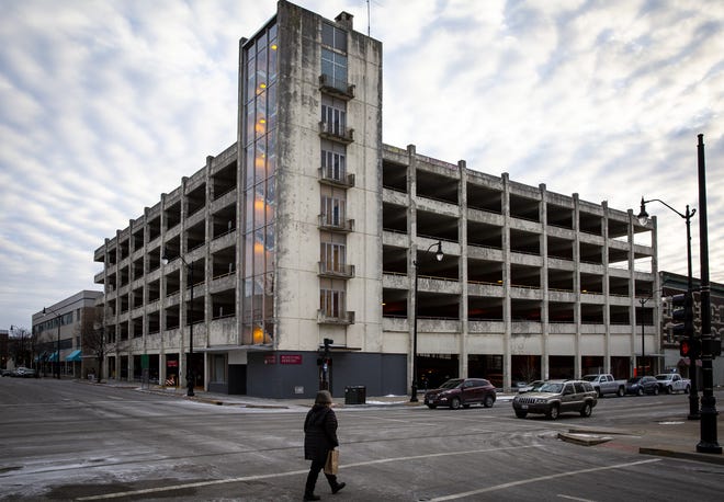 The municipal parking ramp at Fourth and Washington streets would be razed and a mixed-use development including a 95-room hotel would replace it. [Rich Saal/The State Journal-Register]