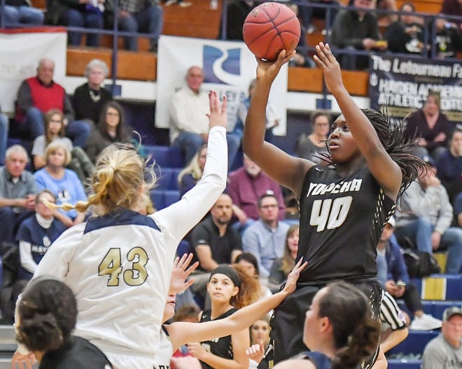 Topeka High's NiJaree Canady, right, enjoyed a big freshman year, leading the Trojan girls to the Class 6A state championship game and earning first-team All-Class 6A honors. [January 2019 Capital-Journal file photo]
