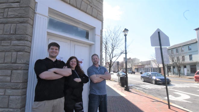 Peter Collipp, Anita Bunnens and Andrew Sloan stand outside Antiques Market on High, which will open to the public March 23. [MARION CALLAHAN / STAFF]