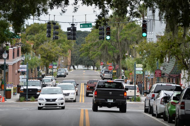 Cars drive down Donnelly Street in downtown Mount Dora. [DAILY COMMERCIAL FILE]