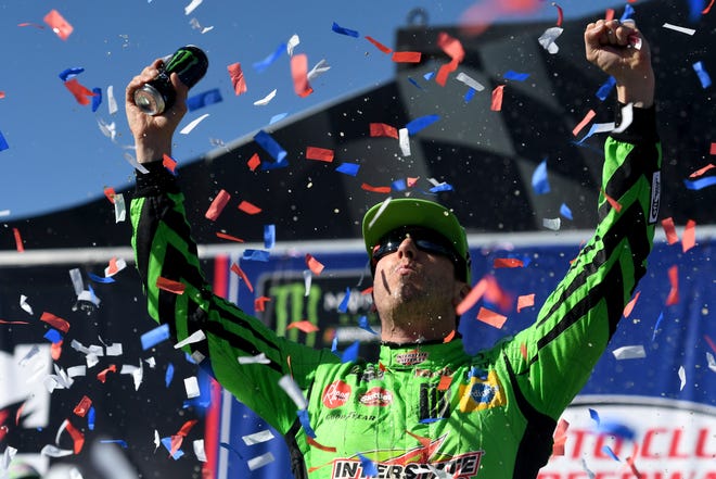 Kyle Busch celebrates after winning the NASCAR Cup Series auto race at Auto Club Speedway in Fontana, Calif., Sunday, March 17, 2019. (James Quigg/The Daily Press via AP)