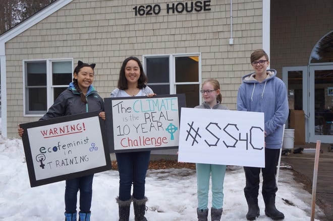 From left, Leyalyn Grenfell-Lee, Telynia Grenfell-Lee, Amelie Calamia and Anya Kipp-McGowan were among students at the Macomber Center in Framingham who participated in the International School Strike for Climate. Students from throughout the world skipped classes on Friday to protest that governments and adults haven’t done enough to address climate change. [Courtesy Photo]
