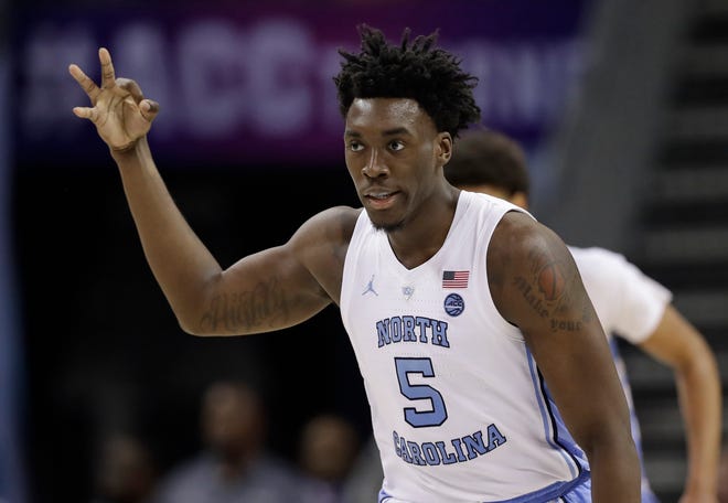 North Carolina's Nassir Little (5) reacts after making a basket against Louisville during the second half of an NCAA college basketball game in the Atlantic Coast Conference tournament in Charlotte, N.C., Thursday, March 14, 2019. (AP Photo/Chuck Burton)