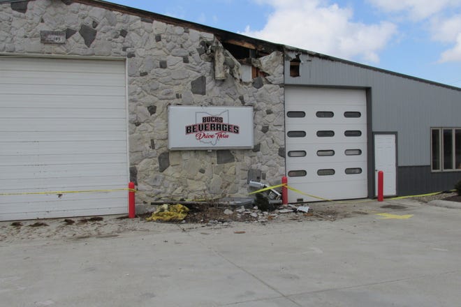 Fire damage is seen Monday from the front of Bucks Beverage Drive Thru on South Washington Street in Millersburg.