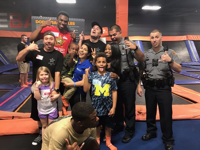 Volusia County children ham it up with local law enforcement and Urban Surf 4 Kids for a night of high flying fun at Sky Zone in Daytona Beach. [Photo provided]
