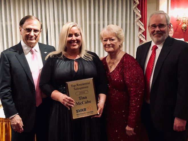 Tina McCabe, second from left, accepts the Top Residential Salesperson Award for 2018 from Larry Lewis, 2019 SVAR president-elect, left; Kathie Braswell, 2019 SVAR president, second from right; and Brett Harris, SVAR 2019 immediate past president, right. [Contributed photo]