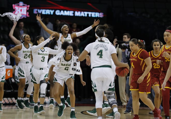 Baylor players celebrate after defeating Iowa State during the Big 12 women's conference tournament championship in Oklahoma City on March 11. Baylor won 67-49. Baylor was selected as the No. 1 seed in the Greensboro Regional of the Women's NCAA Tournament on Monday. [The Associated Press / Alonzo Adams]