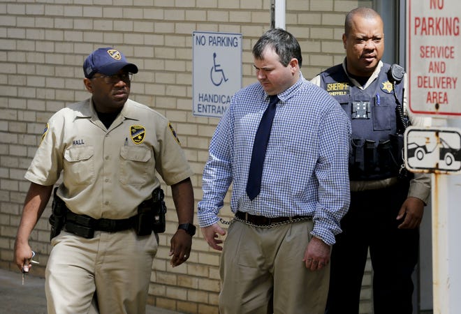 Michael Belcher is escorted from the Tuscaloosa County Courthouse for a lunch break Monday. Belcher is facing a potential death sentence. [Staff Photo/Gary Cosby Jr.]