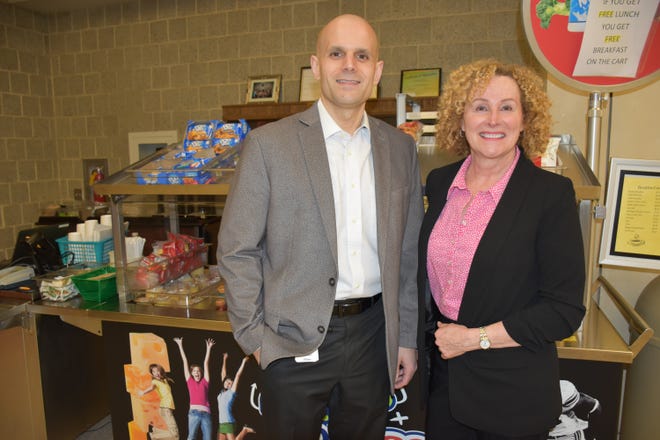 North Penn High School Principal Pete Nicholson, left, with the school's Nutrition Services Area Supervisor Carolann Begley, who was recently honored for helping to start a breakfast cart at the high school. [COURTESY OF NORTH PENN SCHOOL DISTRICT]