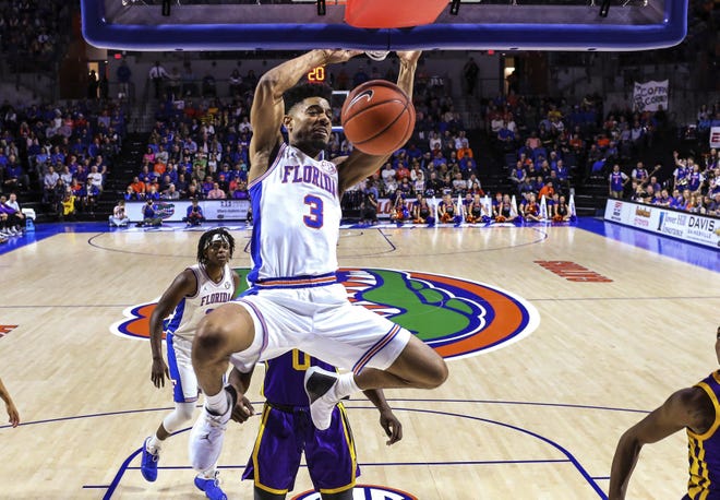 Florida guard Jalen Hudson (3) dunks during the second half of a game against LSU on March 6 in Gainesville. [AP Photo/Gary McCullough]