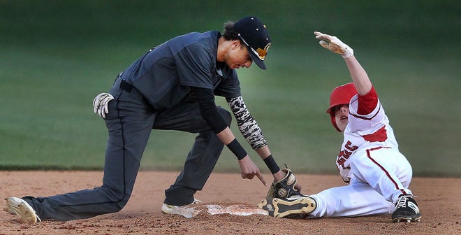 South Point's Will Rinehart slide safely into second with a stolen base as Shelby's Caden Sheely is a little late with the tag during their game Tuesday evening. [JOHN CLARK/THE GASTON GAZETTE]