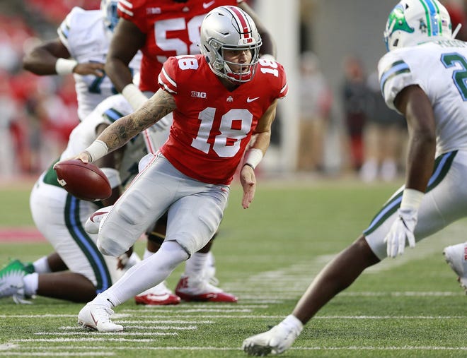 Ohio State quarterback Tate Martell (18) carries the ball in the fourth quarter against Tulane at Ohio Stadium in Columbus, Ohio, last September. Martell, who transferred to Miami, has been granted a waiver from the NCAA that will make him eligible to play immediately. [BROOKE LaVALLEY/Columbus Dispatch/TNS]