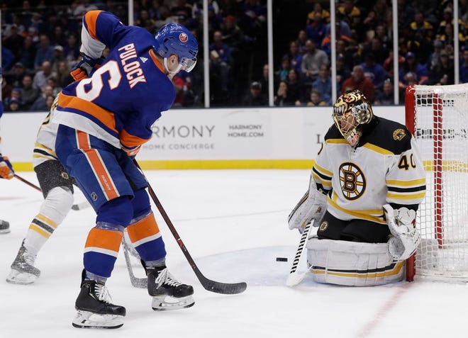 Bruins goaltender Tuukka Rask stops a shot by the Islanders' Ryan Pulock during the second period of Tuesday's game.