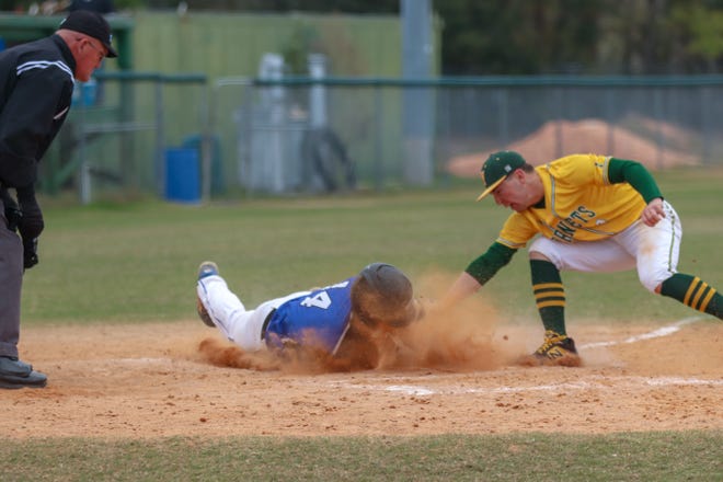 Bartram Trail infielder Blake DeLammielleure is safe at home during the fouth inning Tuesday against Yulee. DeLammielleure scored three runs in Bartram's 7-3 win. [WILL BROWN/THE RECORD]