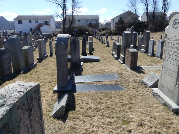 Swastikas and anti-Semitic language were written on at least 30 gravestones at the Hebrew Cemetery on McMahon Street over the weekend, police said. [COURTESY OF FALL RIVER POLICE]