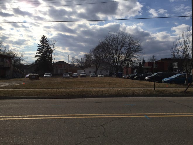 The Tecumseh City Council voted 5-2 Monday to not buy most of this grassy piece of land to expand the city's southeast downtown parking lot.