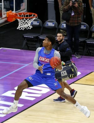 Kansas guard Ochai Agbaji (30) dunks as the team makes their way off the court after open practice at the NCAA Tournament Wednesday, March 20, 2019, in Salt Lake City. [Chris Neal/The Capital-Journal]