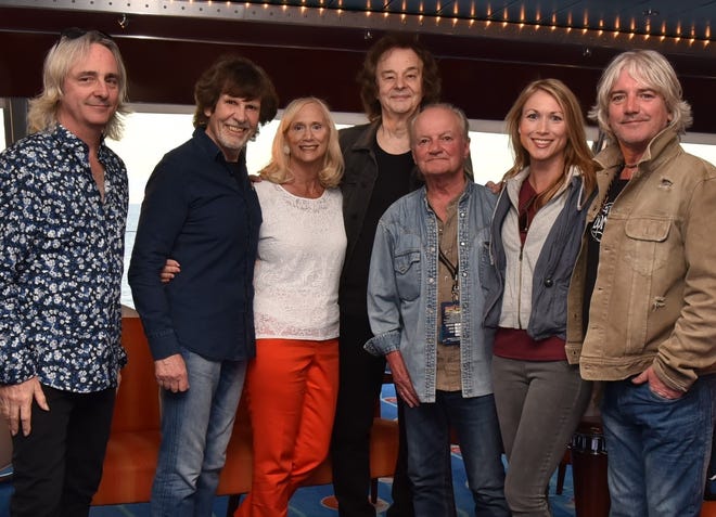 Cruising with The Zombies: Members of the Zombies pose with Nancy King and her daughter, Heather Arp, on a rock cruise. From left: Tom Toomey, Rod Argent, King, Colin Blunstone, Jim Rodford, Arp, Steve Rodford. [Contributed]