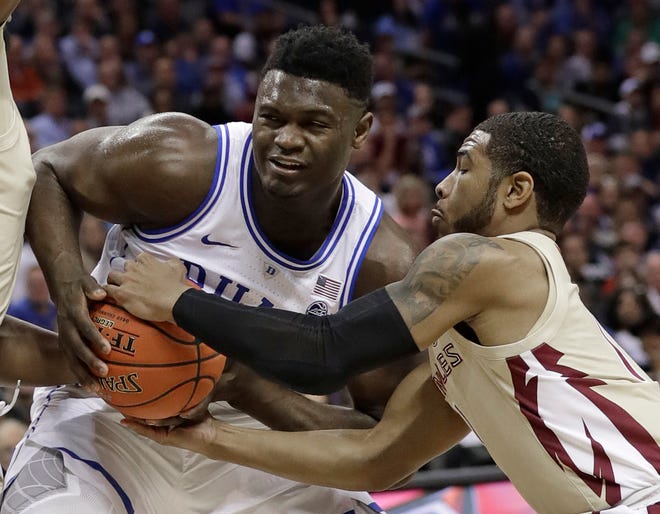 Florida State's David Nichols, right, steals the ball from Duke's Zion Williamson during the Atlantic Coast Conference championship game Saturday night. Will anybody be able to steal a win from the No. 1 overall seeded Blue Devils during the next two-plus weeks. [Chuck Burton/The Associated Press]