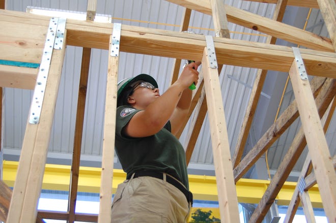 Emily Callahan, AmeriCorps team member, frames interior walls at an Alachua Habitat house in southeast Gainesville. [SPECIAL TO THE GUARDIAN]