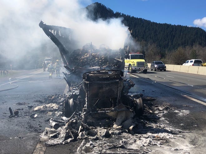 A tractor-trailer that caught fire on Interstate 5 in southwest Oregon charred 7,800 pounds of cantaloupe Thursday. [Oregon Department of Transportation]
