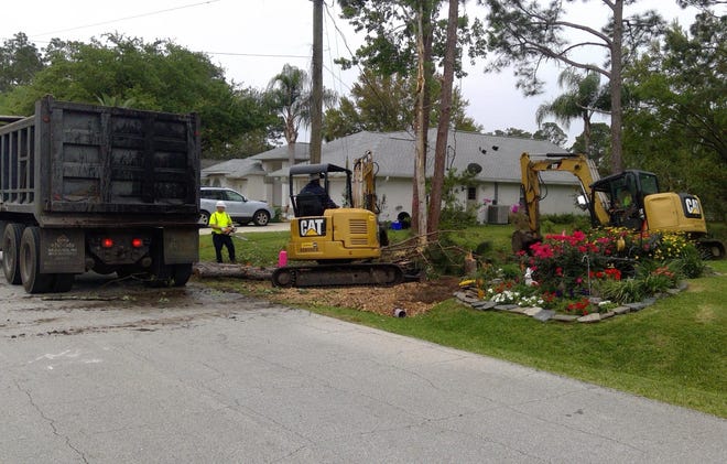 Palm Coast Public Works employees work on the drainage project on Eagle Harbor Trail. [Contributed]