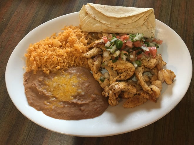 The Fiesta Chicken ($12.99), marinated and grilled chicken breast pieces and shrimp topped with pico de gallo and lime sauce. [Photo by Kathryn Rem]