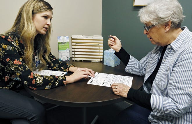 Social worker Megan Badaglia, left, administers a cognitive memory test to Ruth Neal at OhioHealth's Gerlach Center for Senior Health. The screenings are most useful when done in a medical setting, experts say. [Eric Albrecht/Dispatch]