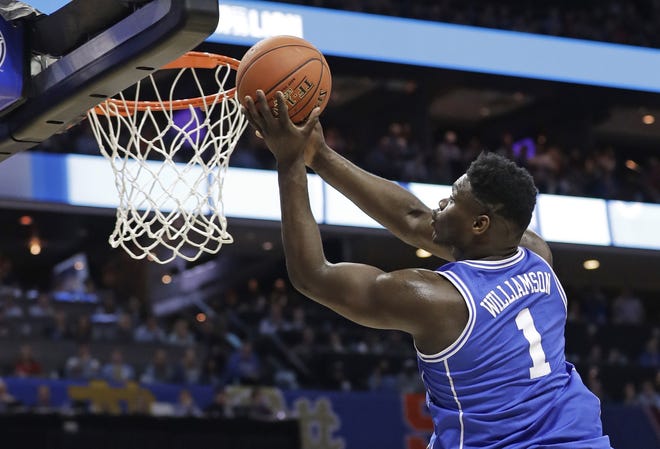 Back in his home state to play as a collegian for the first time, Duke's Zion Williamson credited his parents for helping him prepare for the spotlight. [AP Photo/Chuck Burton]