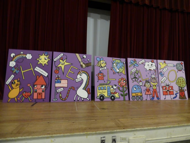 The five paintings were done on canvases. The background color is purple, with each painting having a different shade from dark to light. [News staff photo by Andrew Mansfield]