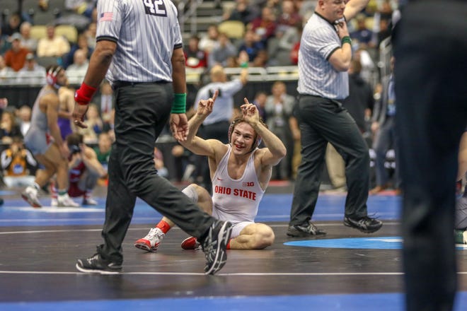 Ohio State's Joey McKenna celebrates his 141-pound quarterfinal win over Minnesota's Mitch McKee at the NCAA Wrestling Championships on Friday in Pittsburgh. (Special to GateHouse Ohio Media / Jim Thrall)