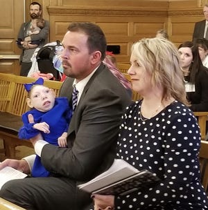 Scott and Gwen Hartley, and their daughter, Lola, attended a House committee hearing Tuesday, March 12, to urge lawmakers to support House Bill 2244 to lower a legal hurdle to treating Lola's microcephaly and other ailments with an oil containing less than 5 percent THC, the active ingredient of marijuana. The Hartleys other daughter, Claire, died in December. [March 2019 file photo/The Capital-Journal]