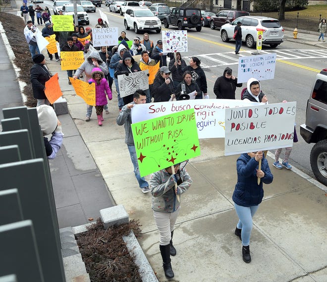 A coalition of immigrants rights groups march from Worcester's Crystal Park to City Hall in support of legislation to allow undocumented immigrants to get drivers licenses Friday. 

[T&G Staff/Steve Lanava]