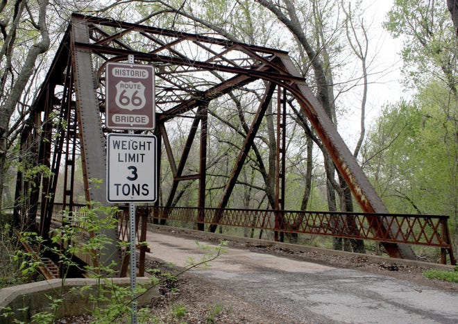 A rusted bridge sits along old Route 66 in Chelsea, Oklahoma in March 2007. An endangered federal program that's helped preserve the historic Route 66 Highway for two decades is issuing its last call for grants next month. [AP Photo/Mel Root]