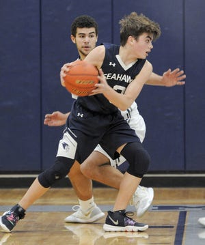 Jaeden Greeleaf (front) of Cape Cod Academy and fellow Cape & Islands League All-Star Isaiah Stafford of Monomoy battled during an early January league game in Harwich. Greenleaf helped the Seahawks into the South Sectional semifinals, while Stafford's Sharks tied Nantucket for the C&I title. Ron Schloerb/Cape Cod Times
