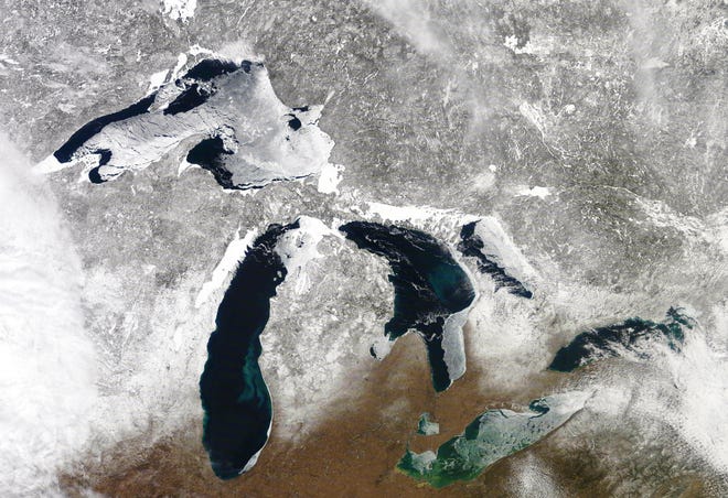 A satellite photo from earlier this month shows different degrees of winter weather around the Great Lakes. [NOAA]