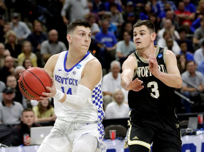 Wofford's Fletcher Magee (3) defends against Kentucky's Tyler Herro during the first half of Saturday's second-round NCAA tournament game in Jacksonville, Fla. [John Raoux/The Associated Press]