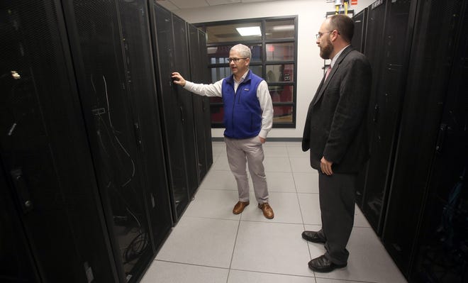 Patrick McHenry asks Jonathan Davis about data centers at Cleveland Community College. [Brittany Randolph/The Star]