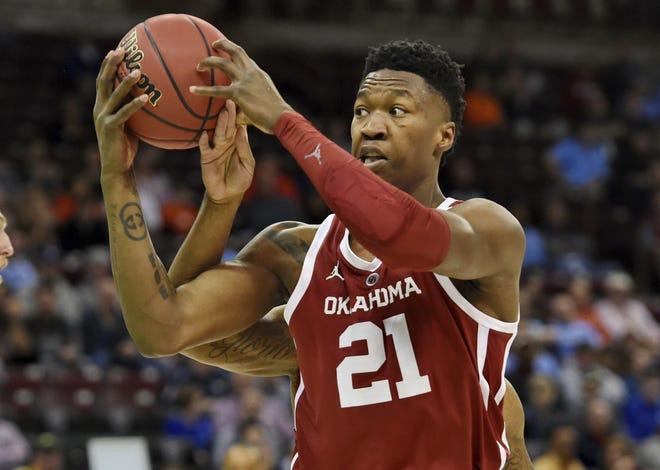 Oklahoma's Kristian Doolittle (21) grabs the rebound during a first-round game in the NCAA Tournament against Mississippi in Columbia, S.C. on Friday, March 22, 2019. [AP Photo/Richard Shiro]