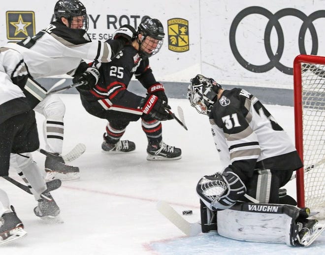 PC goalie Hayden Hawkey, making a save on Northeastern's Patrick Schule during a game on Jan. 25, will lead the Friars against Minnesota State in the first-round of the NCAA Tournament on Saturday in Providence.