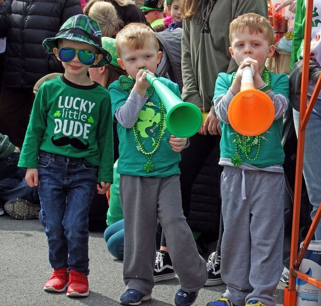 Left to right, Jaxon Hazelwood of Holden turns up the cool with Nolan Renaud and Gavin Renaud of Auburn at the St.Patrick's Parade in Worcester.