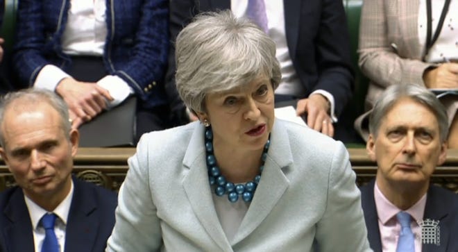 Britain's Prime Minister Theresa May makes a statement on Brexit to lawmakers in the House of Commons, London, Monday. May is under intense pressure Monday to win support for her Brexit deal to split from Europe. [House of Commons]
